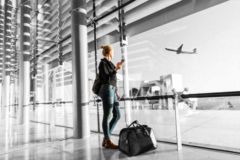 woman-airport-looking-out-window-BW-Color