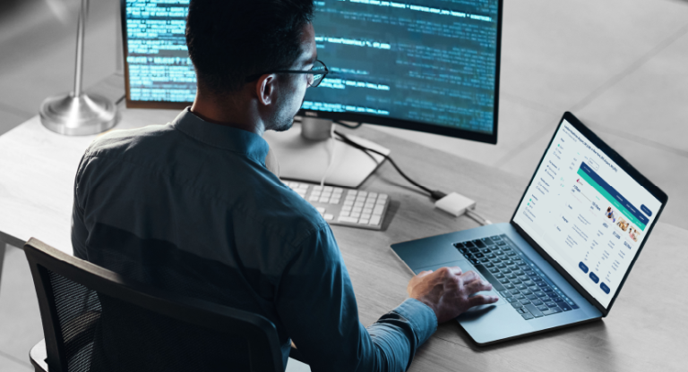Creating airline offers - image of man sitting in front of computers