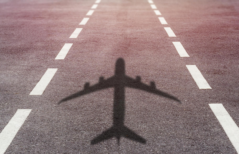 Airplane shadow on runway
