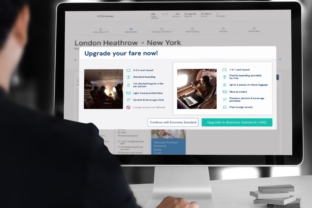 man upgrading fares on computer